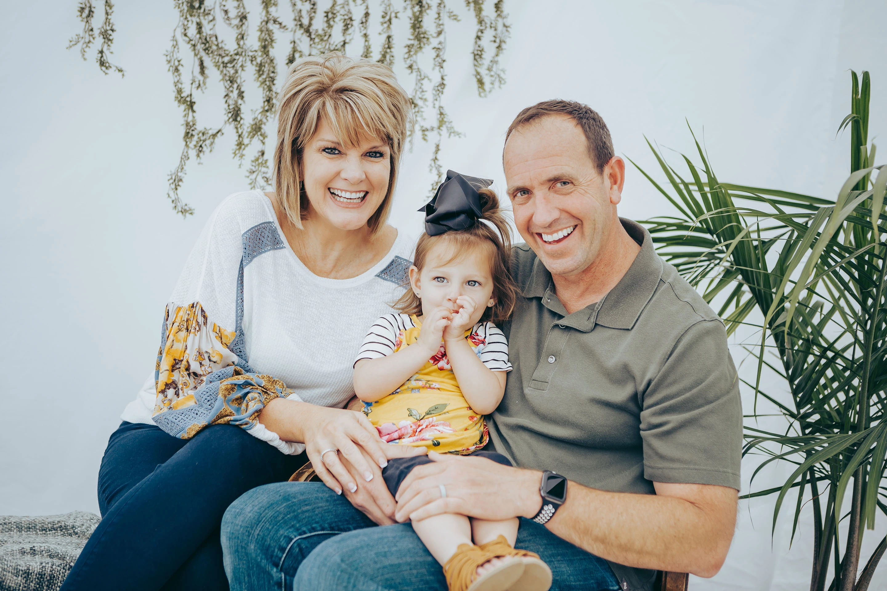 Happy family smiling at Pybus Dental